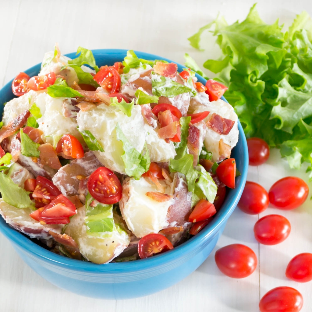 This BLT Potato Salad is so delicious! It is a combination of creamy red potatoes, crisp bacon, sweet tomatoes, and garden fresh lettuce.  Pick Fresh Foods